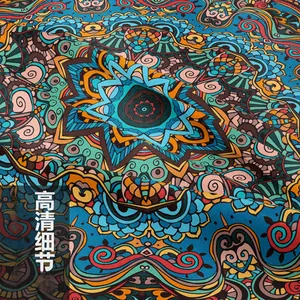 Macro detail of Bohemian mandala tapestry showing rich blue and orange fabric textures