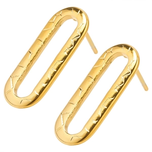 Golden oval stainless steel hoop earrings with geometric star engraving in a modern style