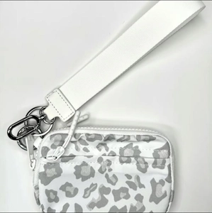 Close-up of portable card wallet with leopard print and sturdy metal ring connector