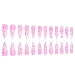 Macro view of long stiletto pink glitter press-on nails with shimmering sequins