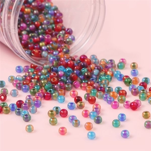 Colorful 4mm iridescent glass seed beads pouring from a jar for DIY jewelry making
