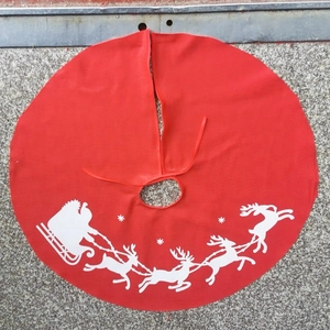 Red 90cm Christmas tree skirt with white reindeer and Santa sleigh print design