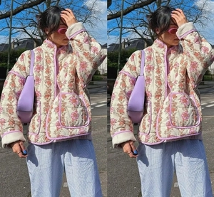 Close-up of quilted floral jacket featuring pink contrast trim and vintage patterns