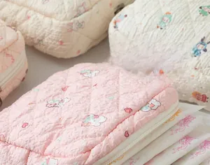 Detailed view of quilted cotton sanitary storage bags with cute rabbit patterns and zipper