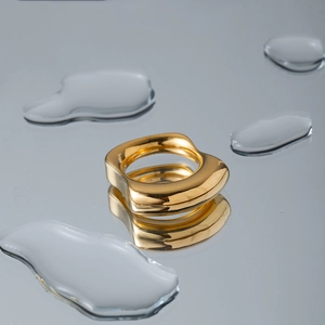 Irregular textured 18k gold stainless steel ring with sculptural design and water droplets