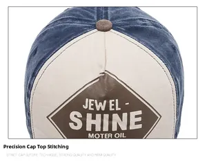 Detailed close-up of blue denim and beige canvas baseball cap with leather logo patch