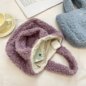 Top view of plush handbags showing interior capacity for phone and accessories