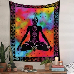 Detailed view of bohemian mandala tapestry featuring meditation silhouette and chakra symbols