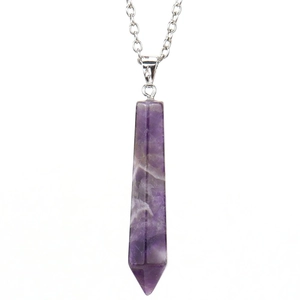 Detailed macro shot of a hexagonal amethyst crystal pendant with silver chain