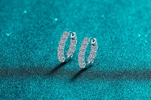 Close-up of S925 sterling silver hoop earrings with shimmering moissanite stones