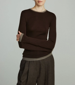 Detail view of the fine knit texture and contrasting trim on this slim wool top