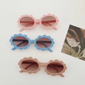 Kids cute flower frame oval sunglasses in pink, blue, and brown tones for outdoor style