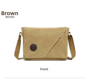 Front view of a brown canvas messenger bag with asymmetrical zipper and adjustable strap