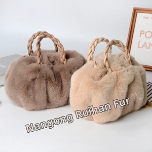 Detailed view of plush faux rabbit fur handbags in coffee and beige with woven handles