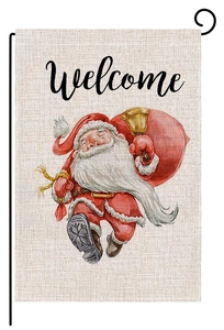 Detail of Christmas garden flag showing watercolor Santa and linen fabric texture