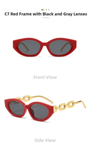 Detail view of red cat eye sunglasses with golden metal chain temples and dark lenses