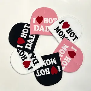 Trendy jacquard beanies with 'I ❤️ HOT DAD' slogan in black, white, and pink colors