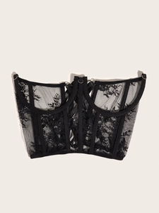 Detail of corset top showing fishbone structure and delicate black floral lace texture