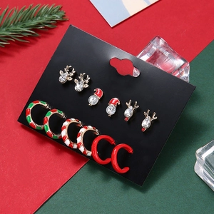 Christmas earring set featuring reindeer studs and festive enamel C-shaped hoops