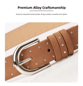 Detailed macro view of brown suede leather belt featuring polished silver rivets and buckle