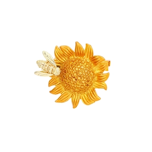 Elegant gold bee and sunflower brooch with textured metal and enamel details