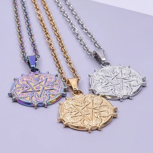 Macro view of goat star pendants in rainbow, gold, and silver finishes with fine detail