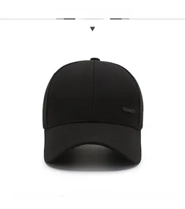 Close-up of black cotton baseball cap with rectangular metal side logo detail