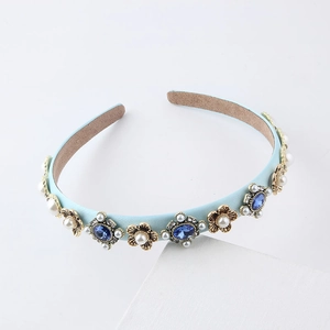 Elegant light blue leather headband with gold flowers, blue gemstones and pearls