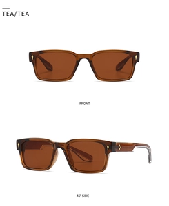 Detail of amber vintage square sunglasses with gold arrow studs on white background