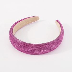 Macro detail of rose pink rhinestone headband with padded sponge and velvet lining