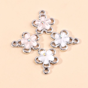 Pink and white enamel flower charms with iridescent rhinestones and silver metal frames