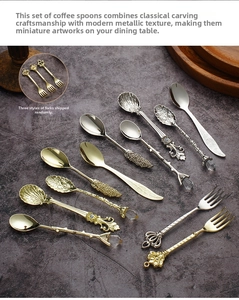 Macro shot of vintage palace style coffee spoons with ornate engraved handles in gold and silver