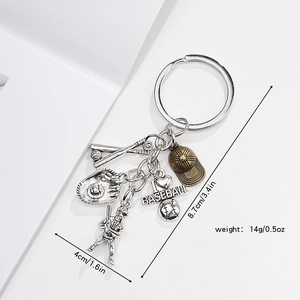 Detailed view of metal baseball keychain charms showing glove, bat and heart pendant