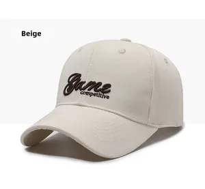 Detail of beige cotton baseball cap featuring brown 'Game competitive' 3D embroidery