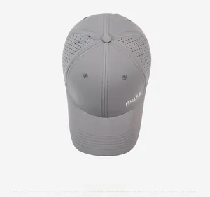 Top view of dark grey baseball cap with laser-cut ventilation holes and side logo