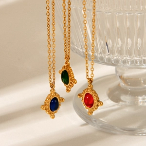 Three gold titanium necklaces with colorful gemstone pendants in retro design