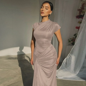 Close-up of ruched detail and tie-waist on a dusty pink slim fit summer dress