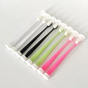 Eight ultra-soft nano toothbrushes in black, white, green, and pink with portable cases