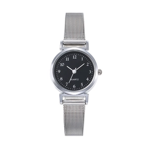 Detail of silver mesh band and black dial quartz watch with Arabic numerals