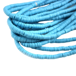 Light blue polymer clay spacer beads for DIY jewelry making displayed in strands