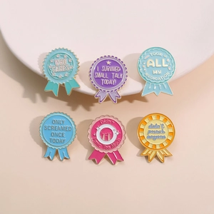 Set of six colorful medal-shaped enamel pins with inspirational phrases in pastel colors