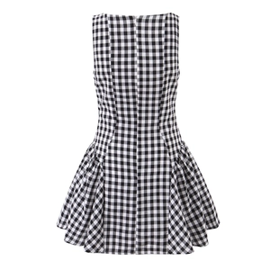 Chic black and white plaid sleeveless dress with a pleated skirt and slim waistline