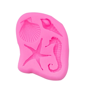 Pink marine silicone mold featuring detailed seashell, seahorse, starfish and conch shapes