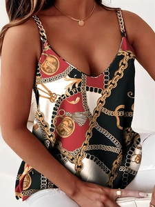 Detailed shot of V-neck sleeveless top featuring baroque print and metal chain straps