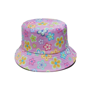 Detail view of purple floral bucket hat with vibrant colorful flower print patterns
