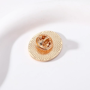 Golden enamel metal badge featuring a secure butterfly clutch pin and textured back finish
