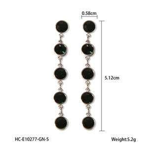 Detailed view of long green crystal drop earrings with precise dimensions and weight