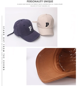Detailed embroidery of letter P on cotton twill baseball caps in navy, beige and caramel