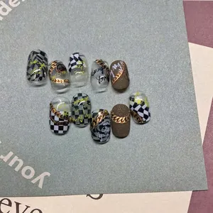 Checkerboard pattern nail stickers with gold chains and letters for DIY manicure