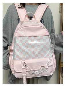 Detailed view of pink nylon backpack with clear window and checkerboard lining